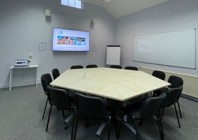 Boardroom set up with media screen