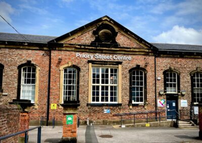 Front view of the Priory Street Centre - Grade II listed building with ramp access