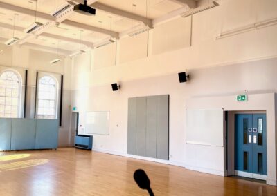 Main Hall with large open space with high ceilings and large windows