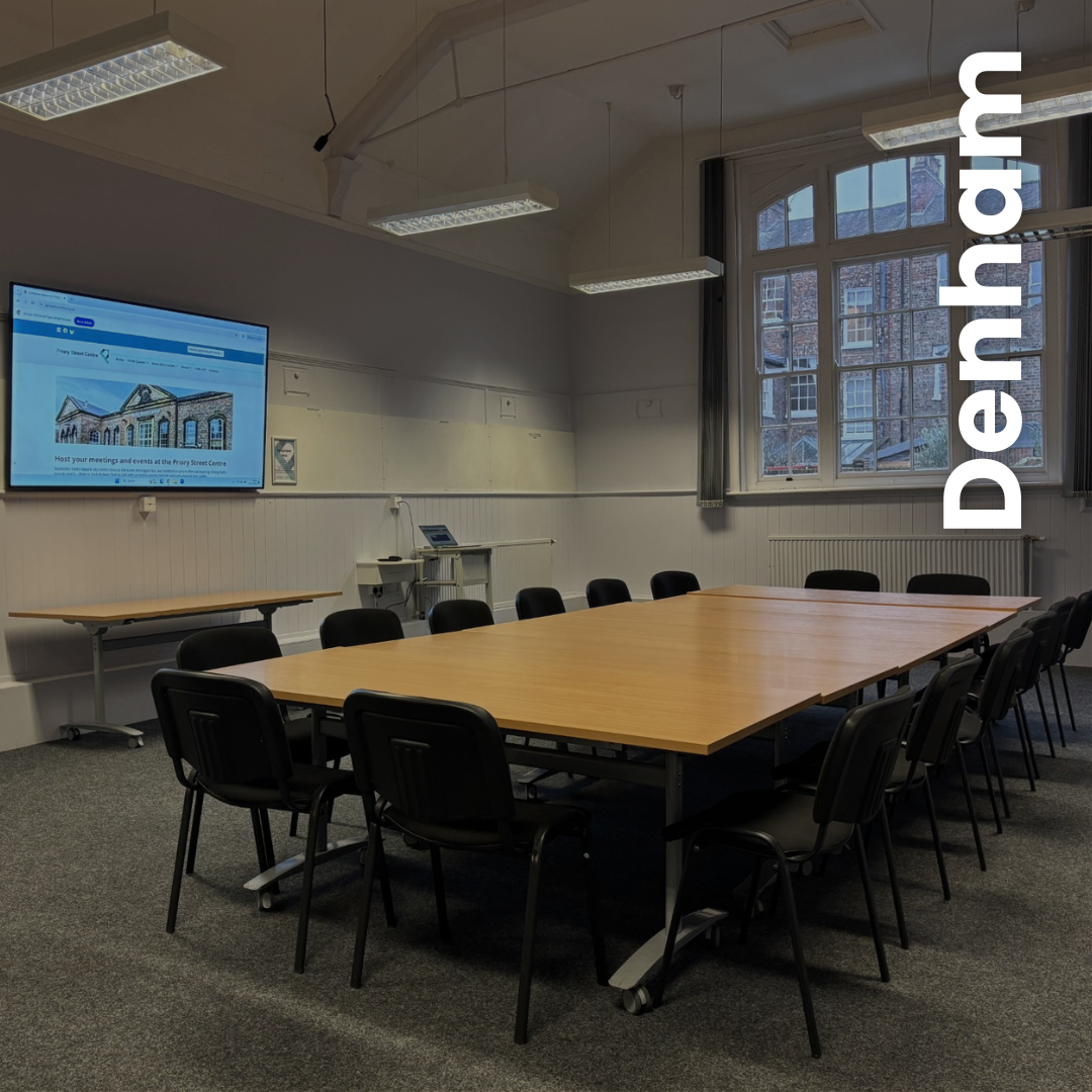 Large meeting room with media screen set-up in a large boardroom seating plan